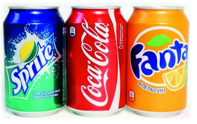 three soft drinks cans together