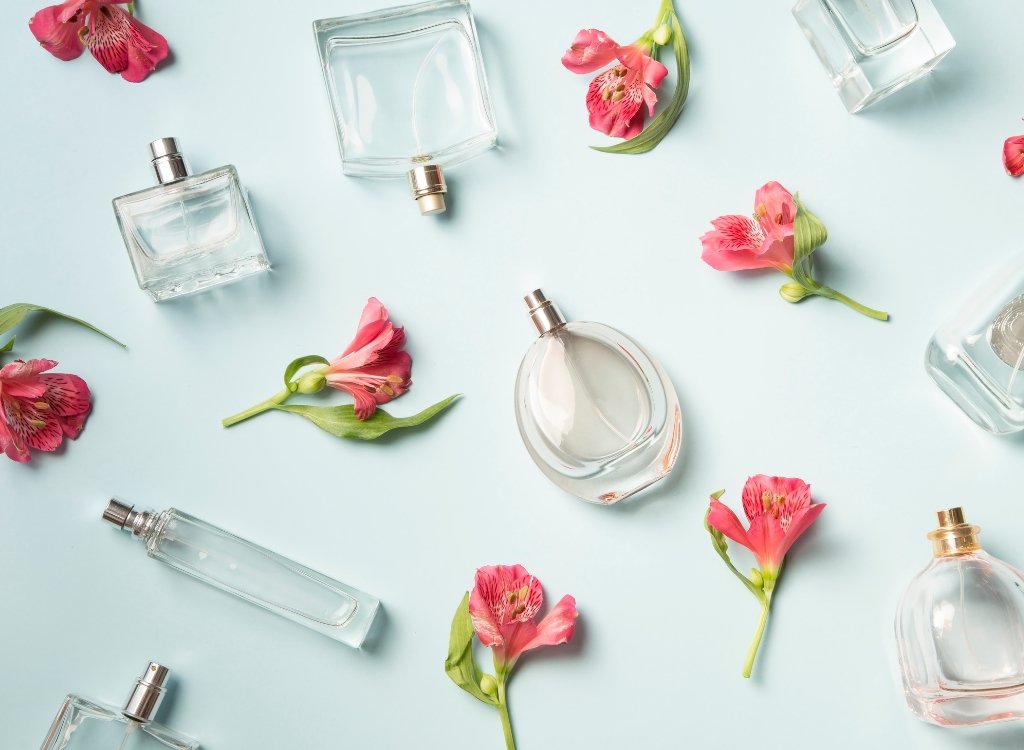 Perfume Bottles and Flowers Background